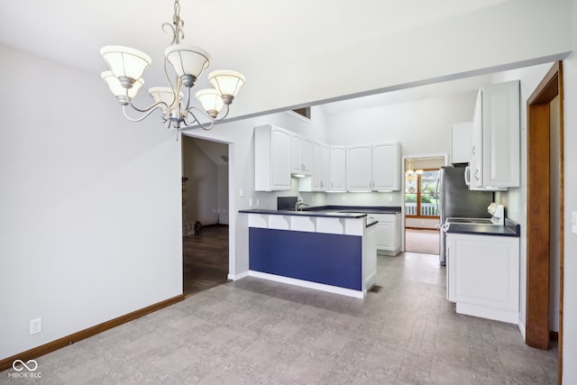 kitchen featuring white cabinets, decorative light fixtures, kitchen peninsula, and light hardwood / wood-style flooring