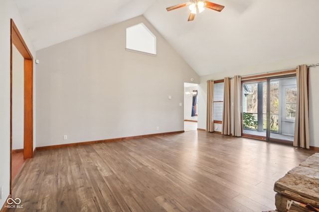 unfurnished living room with high vaulted ceiling, hardwood / wood-style floors, and ceiling fan