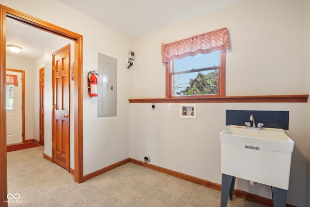 laundry area featuring electric panel, hookup for a washing machine, sink, and electric dryer hookup