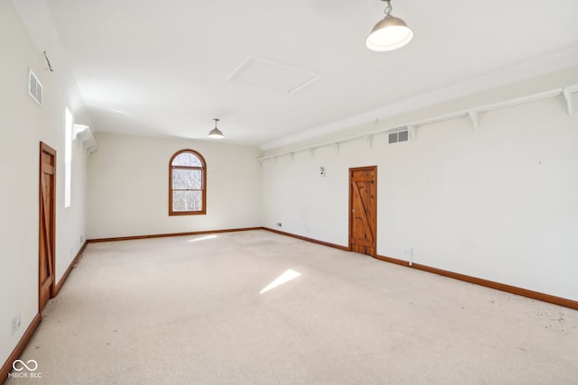 unfurnished room featuring light colored carpet