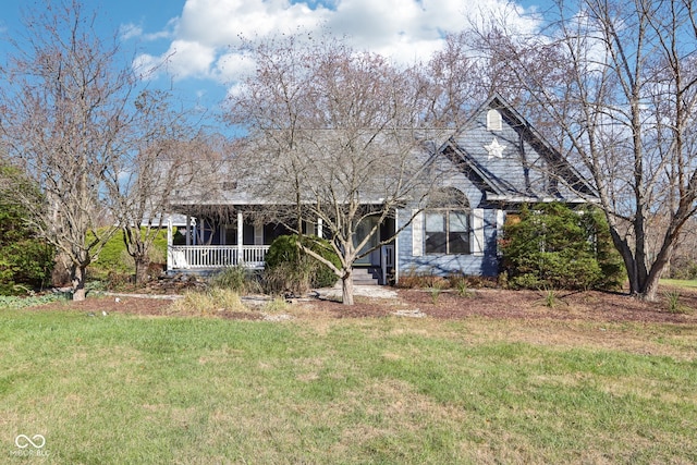 view of front of property with a porch and a front lawn