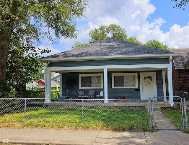 bungalow-style home featuring a porch and a front lawn