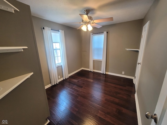 spare room with hardwood / wood-style flooring and ceiling fan