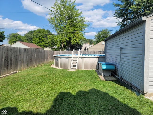 view of yard featuring a fenced in pool