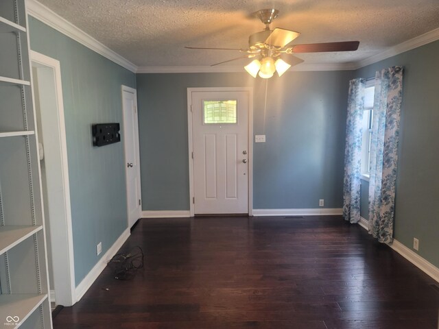 foyer entrance featuring ceiling fan, ornamental molding, hardwood / wood-style floors, and a textured ceiling