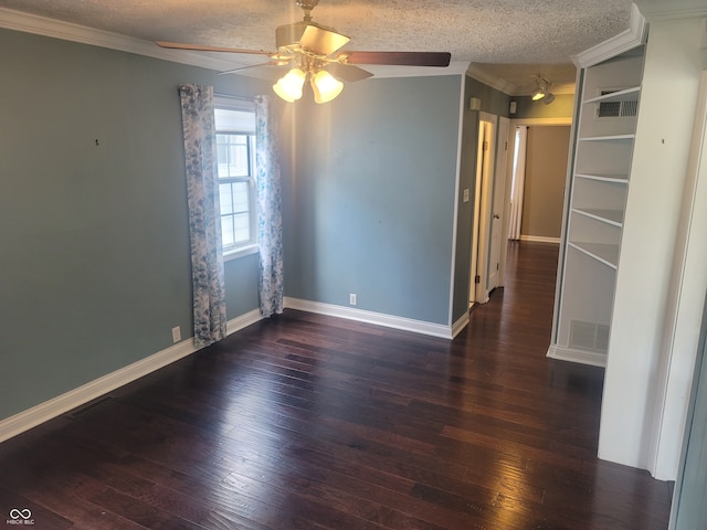 unfurnished room with ceiling fan, hardwood / wood-style flooring, a textured ceiling, and ornamental molding