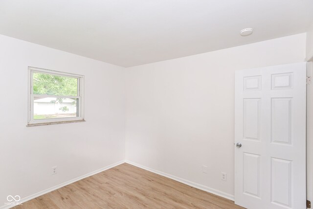 spare room with light hardwood / wood-style flooring