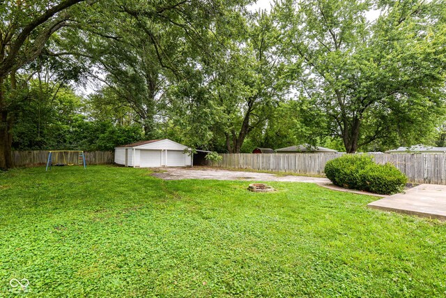 view of yard featuring an outbuilding and a patio