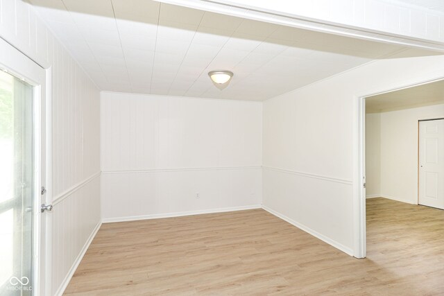 unfurnished room with light wood-type flooring