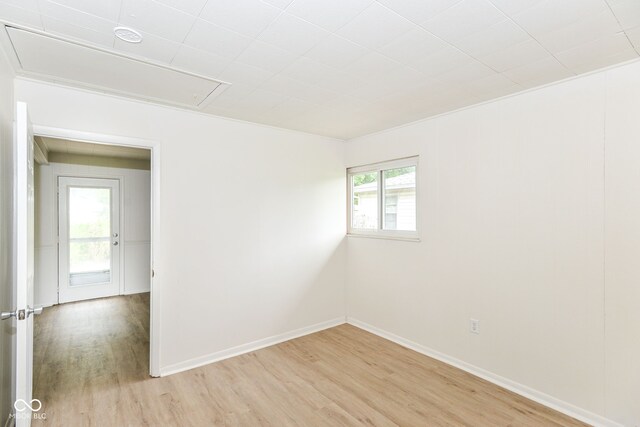 spare room featuring light hardwood / wood-style floors