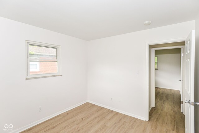 empty room with light wood-type flooring