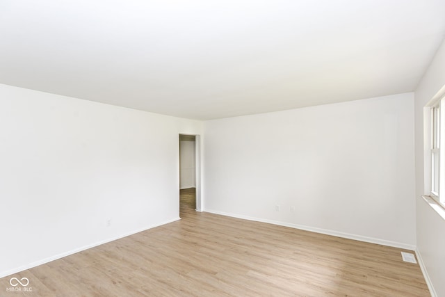 unfurnished room featuring light hardwood / wood-style flooring