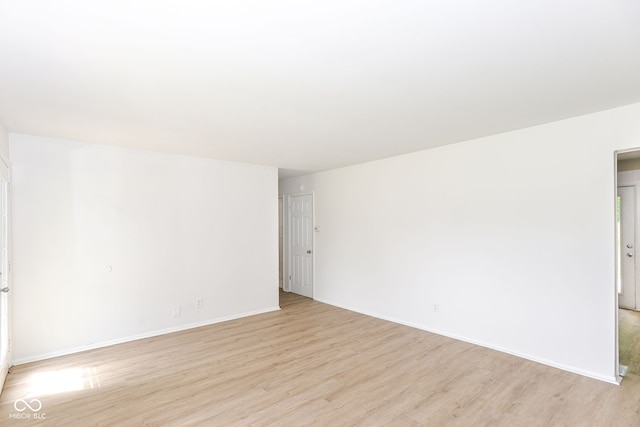 unfurnished room featuring light hardwood / wood-style floors