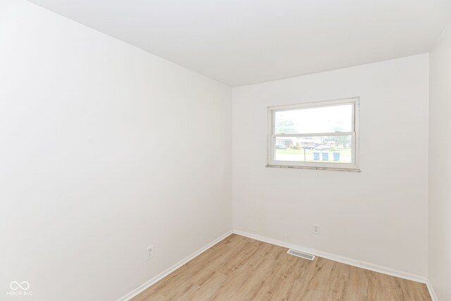 spare room featuring light hardwood / wood-style flooring