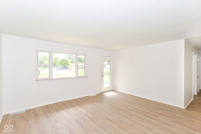 empty room with light wood-type flooring