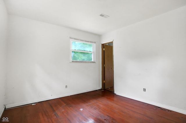 empty room with wood-type flooring