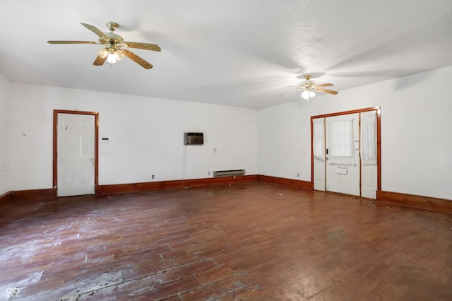 unfurnished room featuring ceiling fan, hardwood / wood-style flooring, and baseboard heating