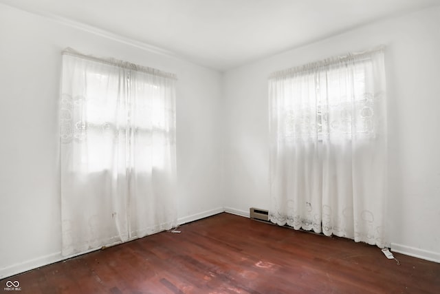 unfurnished room featuring wood-type flooring