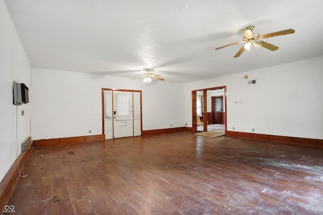 spare room with hardwood / wood-style floors and ceiling fan