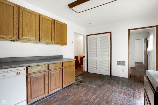 kitchen featuring dishwasher and dark hardwood / wood-style floors