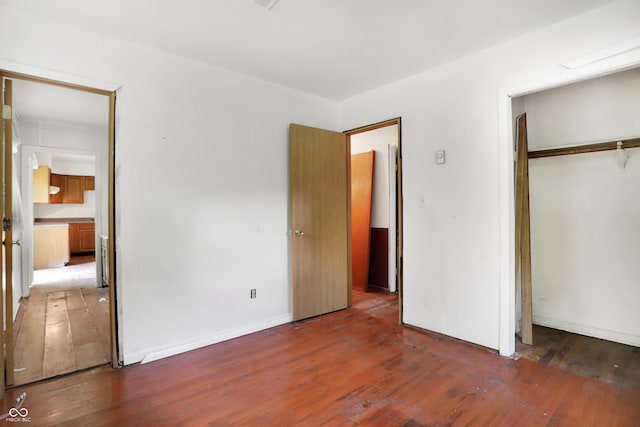 unfurnished bedroom featuring hardwood / wood-style floors