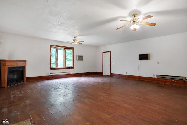 unfurnished living room featuring a wall unit AC, a baseboard radiator, ceiling fan, and dark wood-type flooring