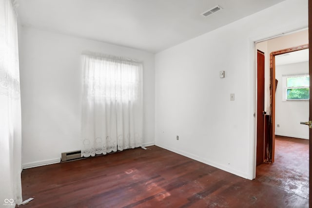 spare room with hardwood / wood-style flooring