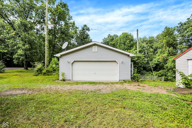 garage featuring a yard