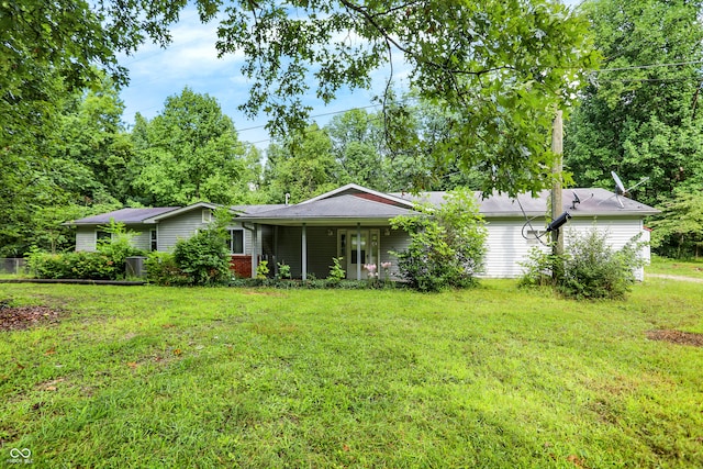 ranch-style house with a front lawn