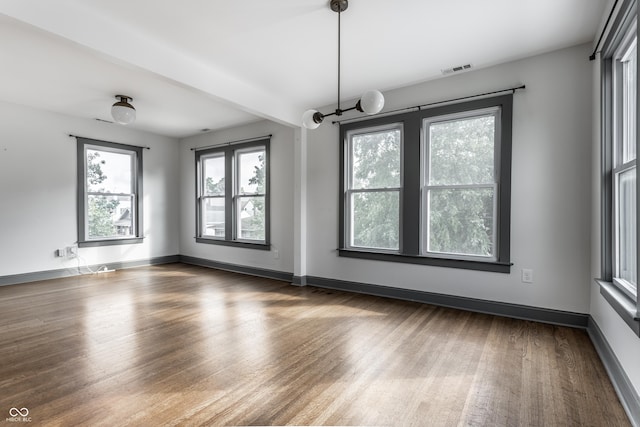 empty room featuring dark hardwood / wood-style flooring