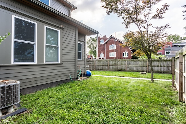 view of yard with central air condition unit