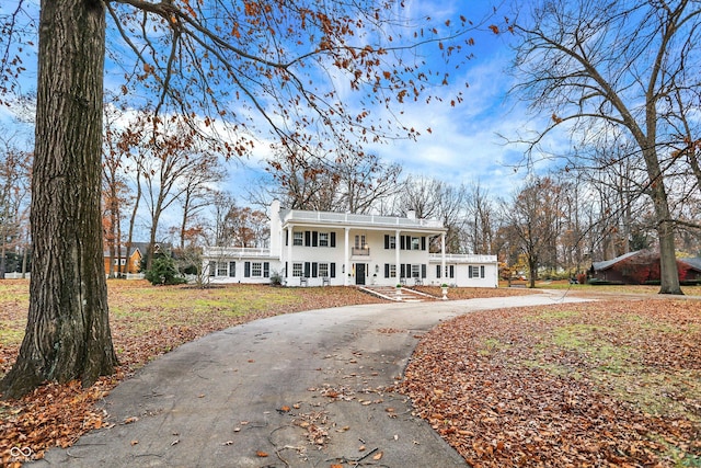 raised ranch with a front lawn