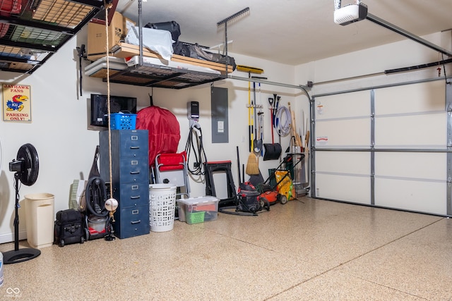 garage featuring a garage door opener and electric panel