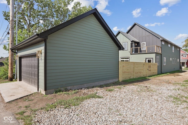 view of side of home featuring a garage