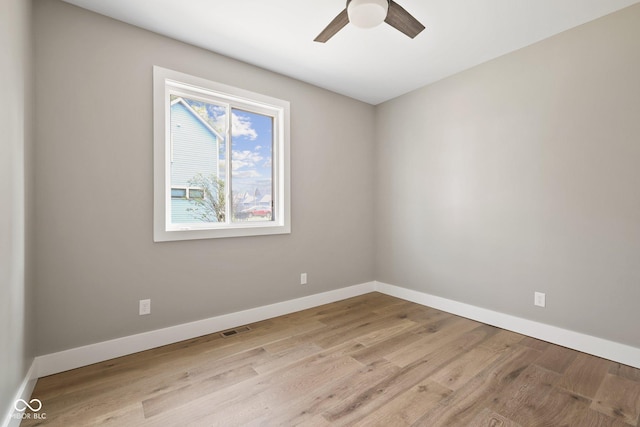 unfurnished room with ceiling fan and light wood-type flooring