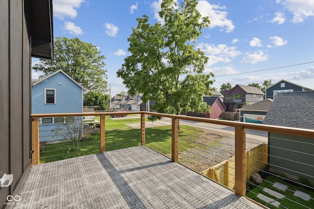 wooden terrace with a yard