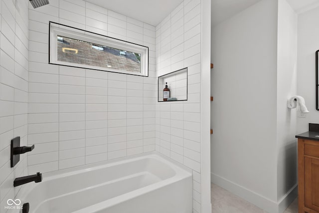 bathroom featuring vanity and tiled shower / bath combo