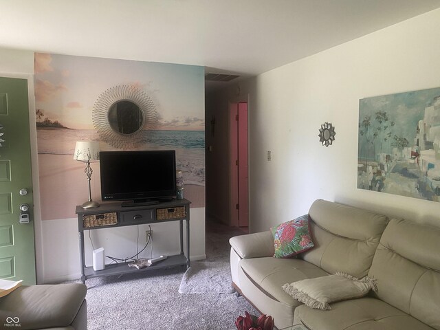 living area featuring carpet flooring and visible vents