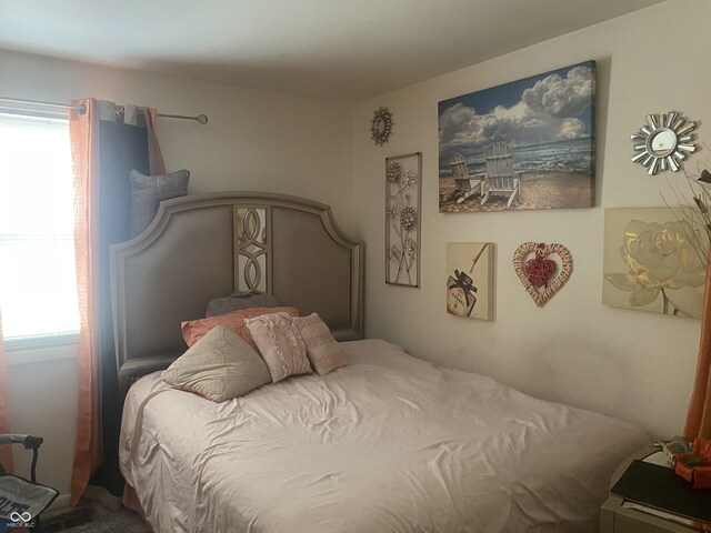 bedroom featuring multiple windows