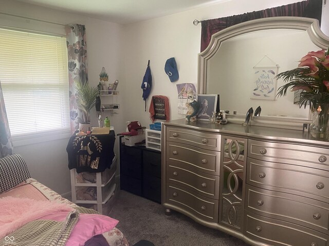 bedroom featuring dark colored carpet