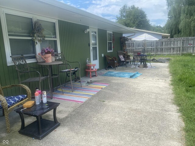 view of patio featuring fence