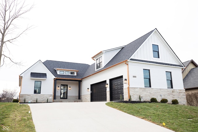 modern farmhouse with a front lawn and a garage