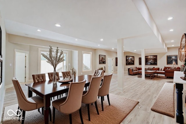 dining area with decorative columns, baseboards, light wood-style floors, a fireplace, and recessed lighting