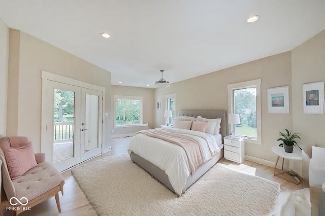 bedroom featuring access to exterior, french doors, recessed lighting, light wood-type flooring, and baseboards