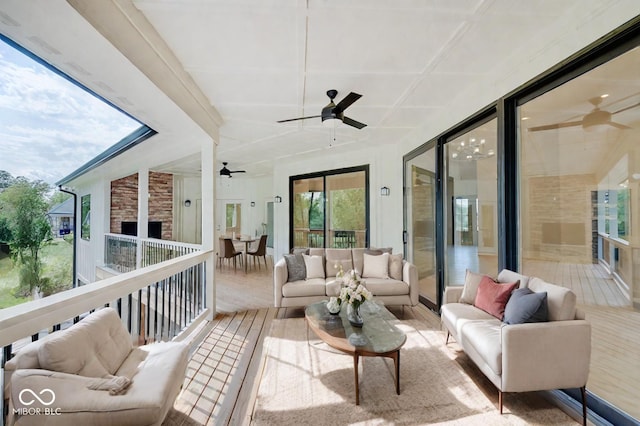 sunroom featuring ceiling fan