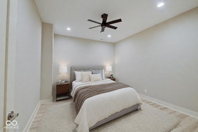 bedroom with light wood-type flooring and ceiling fan