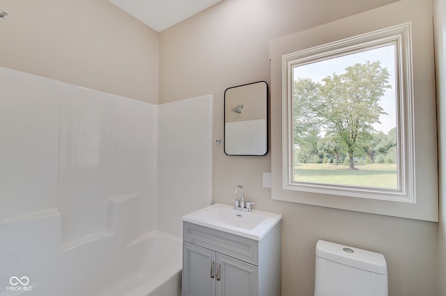 full bathroom featuring vanity, toilet, and shower / bathtub combination