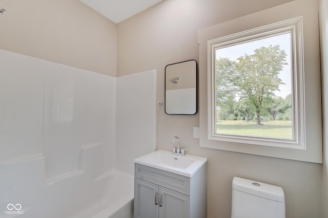 full bath with toilet and vanity