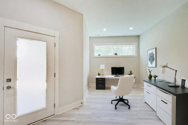 office space featuring light wood-type flooring, baseboards, and recessed lighting