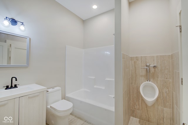 full bathroom featuring vanity, toilet, and tiled shower / bath